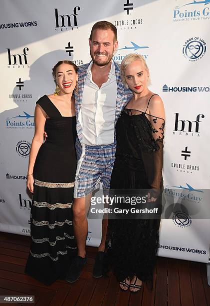 Brian Kelly with DJ Mia Moretti and violinist Margot of The Dolls attend Housing Works' Labor of Love on September 5, 2015 in East Hampton, N.Y.