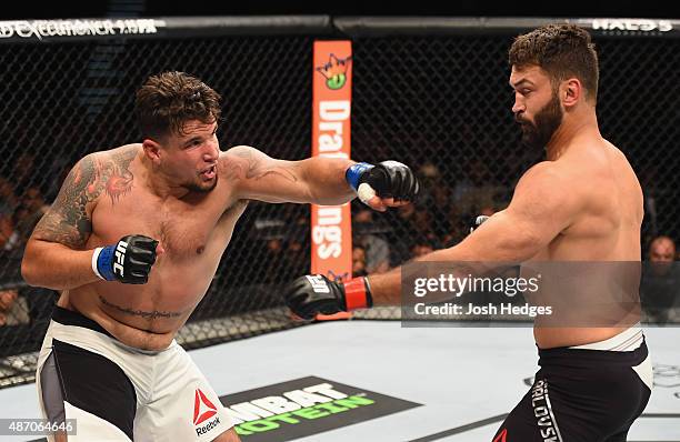 Frank Mir punches Andrei Arlovski in their heavyweight bout during the UFC 191 event inside MGM Grand Garden Arena on September 5, 2015 in Las Vegas,...