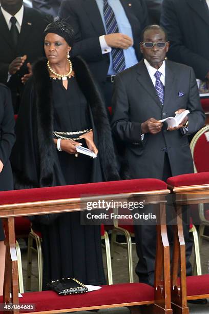 Zimbabwe's President Robert Mugabe flanked by his wife Grace attend the canonisations of Popes John Paul II and John XXIII held by Pope Francis in...