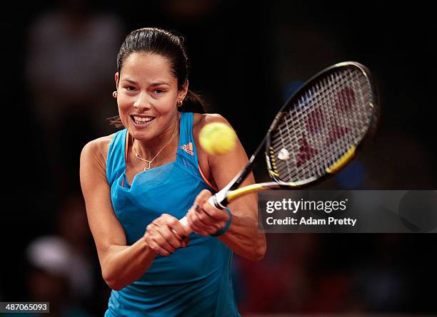 Ana Ivanovic of Serbia hits a backhand during the final against Maria Sharapova of Russia on day seven of the Porsche Tennis Grand Prix 2014 at...