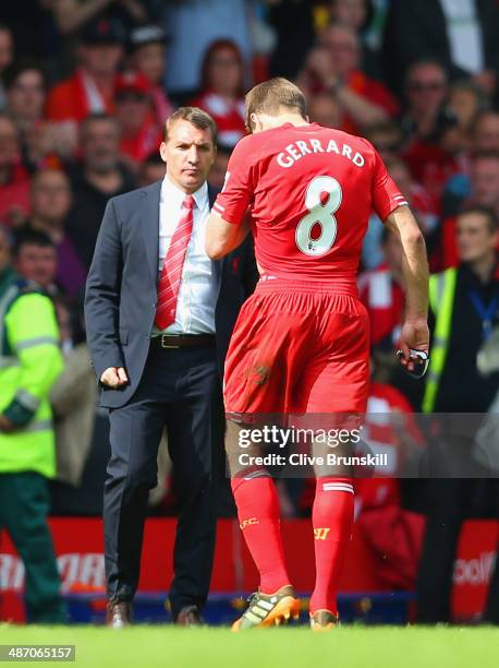 Steven Gerrard of Liverpool shakes hands with Manager Brendan Rodgers of Liverpool at the end of the match during the Barclays Premier League match...