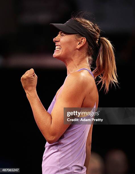 Maria Sharapova of Russia celebrates a point during the final against Ana Ivanovic of Serbia on day seven of the Porsche Tennis Grand Prix 2014 at...