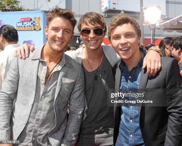 Singers Drew Chadwick, Wesley Stromberg and Keaton Stromberg of Emblem3 arrive at the 2014 Radio Disney Music Awards at Nokia Theatre L.A. Live on...