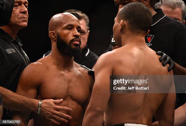 Demetrious Johnson and John Dodson face off in their flyweight championship bout during the UFC 191 event inside MGM Grand Garden Arena on September...