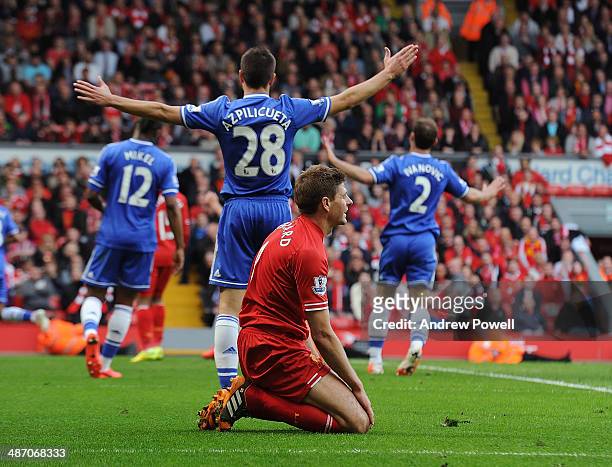 Steven Gerrard of Liverpool looks dejected during the Barclays Premier League match between Liverpool and Chelsea at Anfield on April 27, 2014 in...