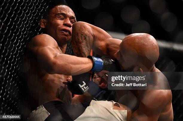 Demetrious Johnson elbows John Dodson in their flyweight championship bout during the UFC 191 event inside MGM Grand Garden Arena on September 5,...
