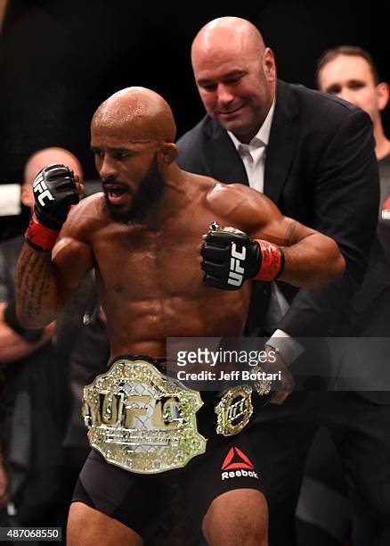 Demetrious Johnson reacts after his victory over John Dodson in their flyweight championship bout during the UFC 191 event inside MGM Grand Garden...