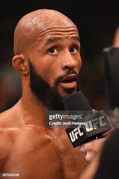 Demetrious Johnson speaks after his victory over John Dodson in their flyweight championship bout during the UFC 191 event inside MGM Grand Garden...