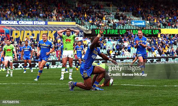 Semi Radradra of the Eels celebrates his 23rd try for the season during the round 26 NRL match between the Parramatta Eels and the Canberra Raiders...