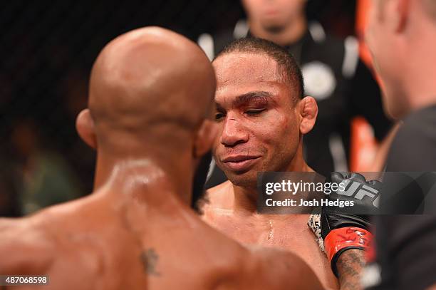 Demetrious Johnson and John Dodson speak after their flyweight championship bout during the UFC 191 event inside MGM Grand Garden Arena on September...