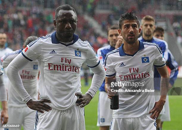 Jacques Zoua and Kerem Demirbay of Hamburg react after the Bundesliga match between FC Augsburg and Hamburger SV at SGL Arena on April 27, 2014 in...