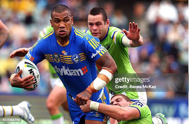 Manu Ma'u of the Eels is tackled by the Raiders defence during the round 26 NRL match between the Parramatta Eels and the Canberra Raiders at Pirtek...