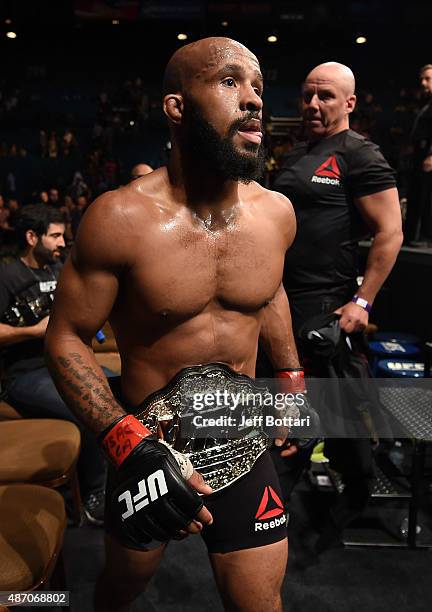Demetrious Johnson walks out of the Octagon after defeating John Dodson in their flyweight championship bout during the UFC 191 event inside MGM...