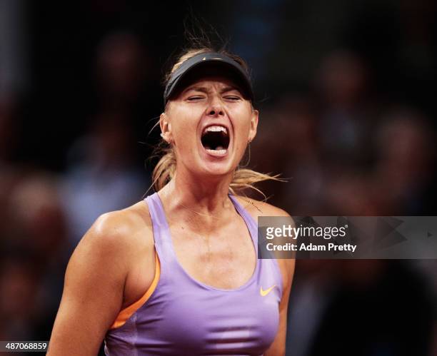 Maria Sharapova of Russia celebrates victory in the final against Ana Ivanovic of Serbia on day seven of the Porsche Tennis Grand Prix 2014 at...