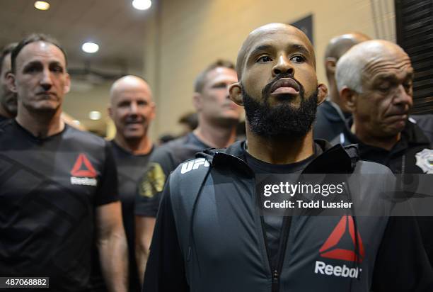 Demetrious Johnson prepares to face John Dodson backstage during the UFC 191 event inside MGM Grand Garden Arena on September 5, 2015 in Las Vegas,...