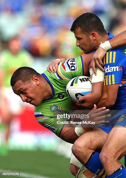 Josh Papalii of the Raiders is tackled by Luke Kelly of the Eels during the round 26 NRL match between the Parramatta Eels and the Canberra Raiders...