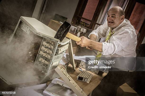 businessman hitting hammer on cpu - sledgehammer stock pictures, royalty-free photos & images