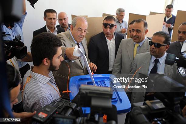 Iraqi politician Ayad Allawi votes in the Iraqi parliamentary elections at a polling station April 27, 2014 in Amman, Jordan. Iraq's former prime...