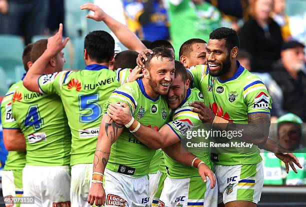 Josh Hodgson celebrates his try with team mates in golden point time during the round 26 NRL match between the Parramatta Eels and the Canberra...