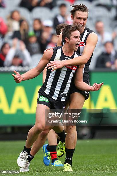 Ben Kennedy of the Magpies celebrates a goal during the round 23 AFL match between the Collingwood Magpies and the Essendon Bombers at Melbourne...