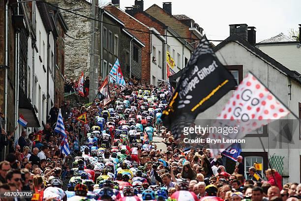 The peloton arrive at the bottom of the Col de Saint Roch during the 100th edition of the Liege-Bastogne-Liege road race on April 27, 2014 in...