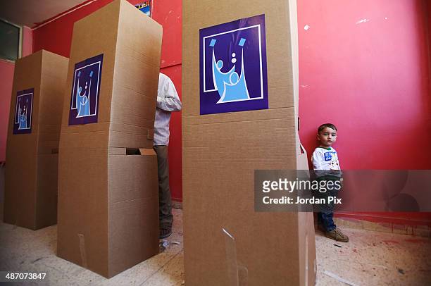 Person votes in the Iraqi parliamentary elections at a polling station April 27, 2014 in Amman, Jordan. Iraq's former prime minister Ayad Allawi on...
