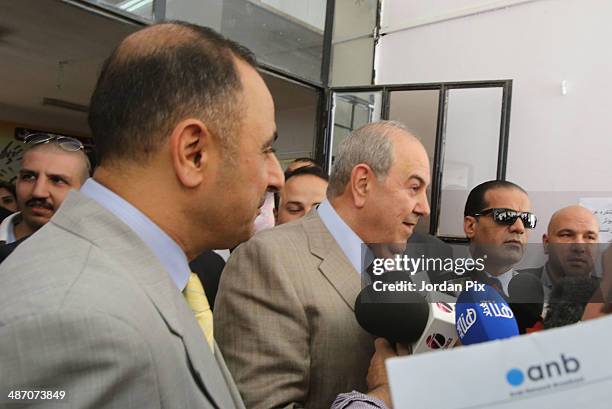 Iraqi politician Ayad Allawi speaks to the press after voting in the Iraqi parliamentary elections at a polling station April 27, 2014 in Amman,...