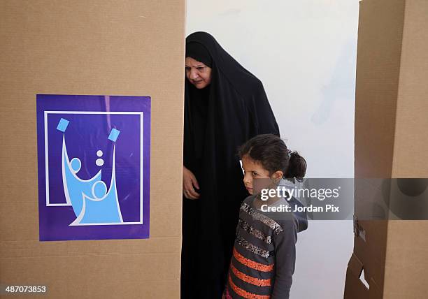 Person votes in the Iraqi parliamentary elections at a polling station April 27, 2014 in Amman, Jordan. Iraq's former prime minister Ayad Allawi on...