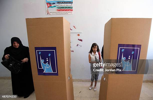 People vote in the Iraqi parliamentary elections at a polling station April 27, 2014 in Amman, Jordan. Iraq's former prime minister Ayad Allawi on...