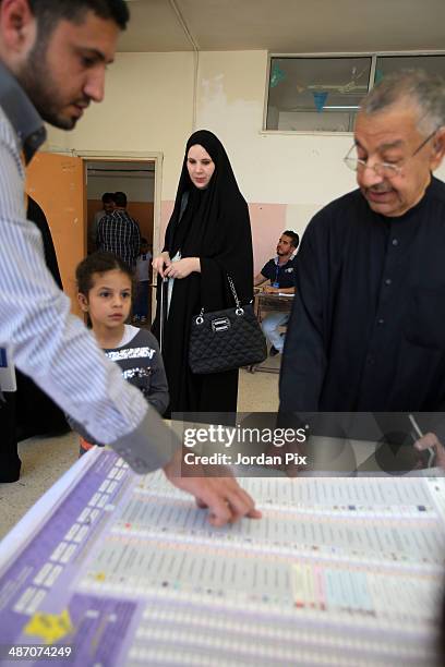 Person votes in the Iraqi parliamentary elections at a polling station April 27, 2014 in Amman, Jordan. Iraq's former prime minister Ayad Allawi on...