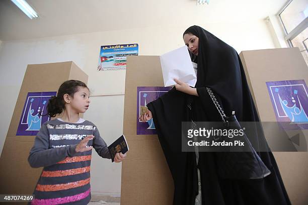 Person votes in the Iraqi parliamentary elections at a polling station April 27, 2014 in Amman, Jordan. Iraq's former prime minister Ayad Allawi on...