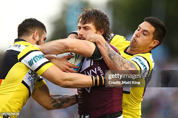 Kieran Foran of the Sea Eagles is tackled during the round 26 NRL match between the Cronulla Sharks and the Manly Sea Eagles at Remondis Stadium on...