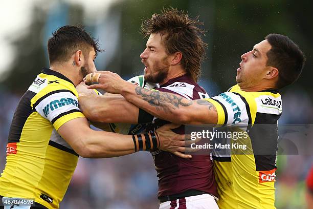 Kieran Foran of the Sea Eagles is tackled during the round 26 NRL match between the Cronulla Sharks and the Manly Sea Eagles at Remondis Stadium on...