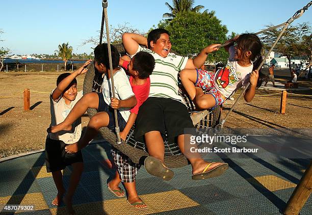 Samoan children play on a swing in a playground during the preview day of the Vth Commonwealth Youth Games on September 6, 2015 in Apia, Samoa.
