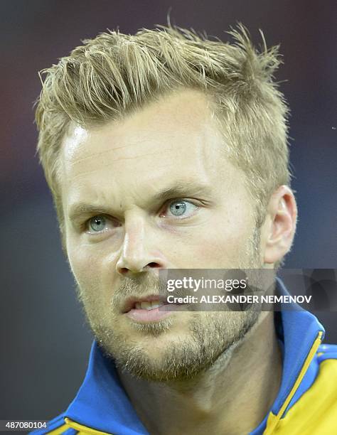 Sweden's midfielder Sebastian Larsson listens to the national anthem before an UEFA Euro-2016 qualifying round Group G football match between Russia...