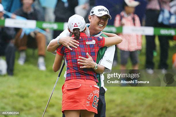 Bo-Mee Lee of South Korea celebrates with her caddie after winning the Golf 5 Ladies Tournament 2015 at the Mizunami Country Club on September 6,...