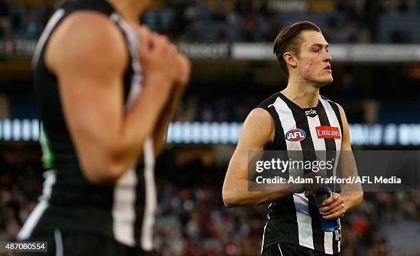 Darcy Moore of the Magpies looks dejected after a loss during the 2015 AFL round 23 match between the Collingwood Magpies and the Essendon Bombers at...