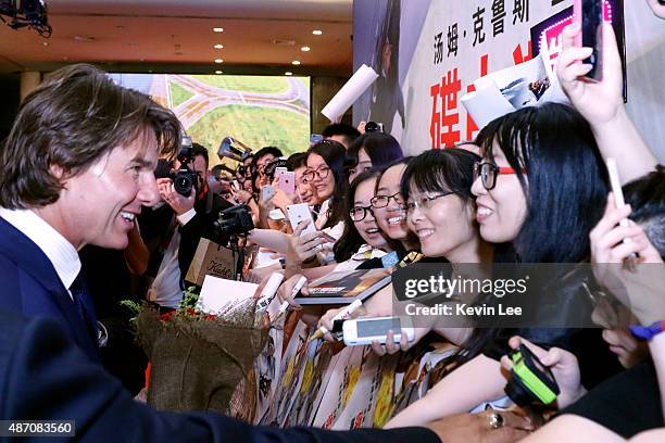 Tom Cruise meet with fans at the Red Carpet at the Shanghai premiere of Mission: Impossible - Rogue Nation at the Shanghai Film Center on August 6,...