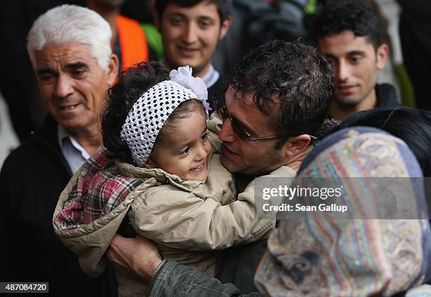 Family from Kobane, Syria, some of whom had just arrived on a train from Hungary and others who have already been in Germany for two months, are...