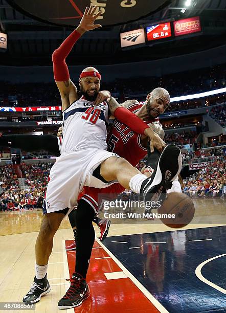 Drew Gooden of the Washington Wizards and Carlos Boozer of the Chicago Bulls fight for a rebound in Game Four of the Eastern Conference Quarterfinals...