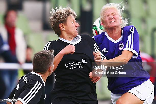 Alexandra Papke of SG Dirmingen jumps for a header with Petra Feinbube-Rossbach of Tennis Borussia Berlin during the DFB Women's Over35 Cup on...