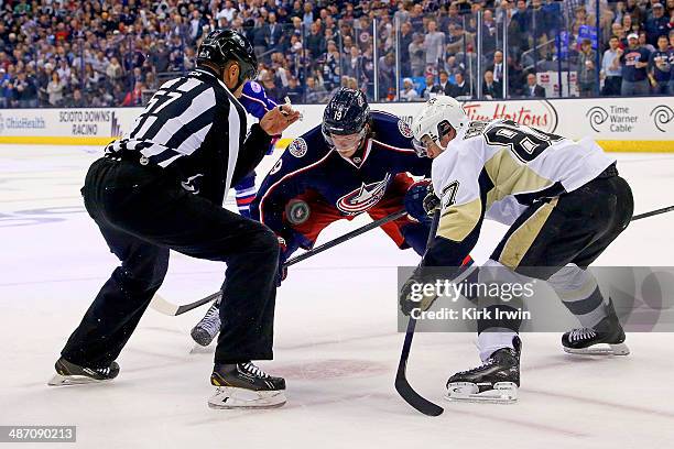 Linesman Jay Sharrers drops the puck for Ryan Johansen of the Columbus Blue Jackets and Sidney Crosby of the Pittsburgh Penguins in Game Four of the...