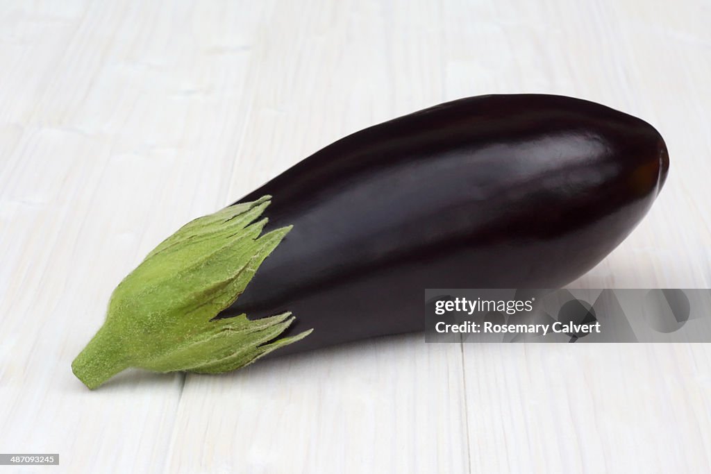 Organic aubergine on white background