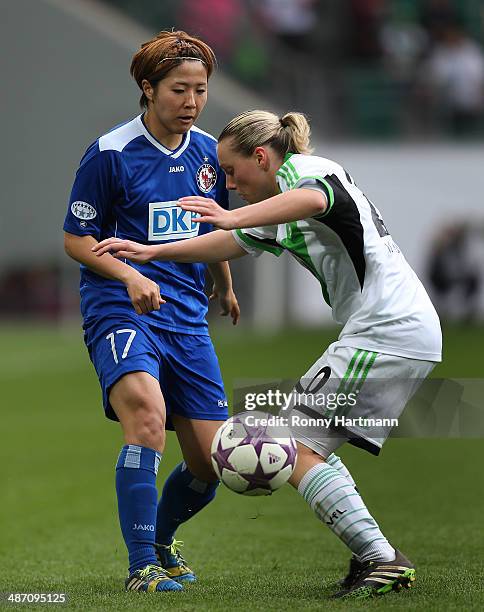 Asano Nagasato of Potsdam and Stephanie Bunte of Wolfsburg vie during the second UEFA Women's Champions League semi final match between VfL Wolfsburg...