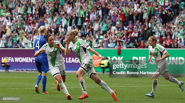 Alexandra Popp of Wolfsburg celebrates her team's third goal with Nadine Kessler and Martina Mueller during the second UEFA Women's Champions League...