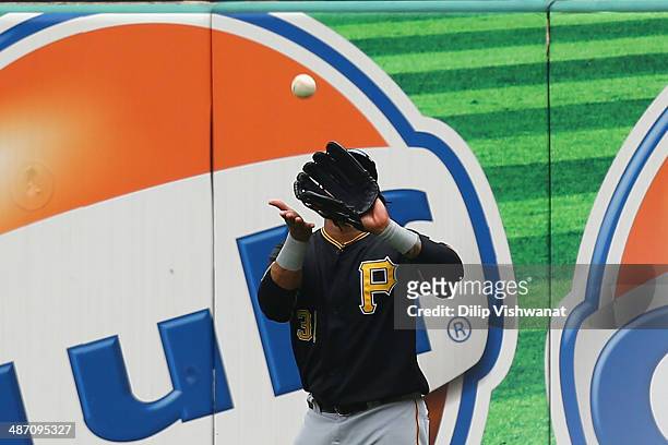 Jose Tabata of the Pittsburgh Pirates catches a fly ball in the third inning against the St. Louis Cardinals at Busch Stadium on April 27, 2014 in...