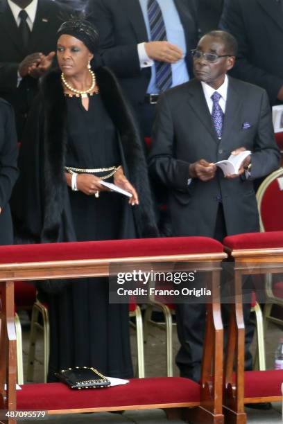 Zimbabwe's President Robert Mugabe flanked by his wife Grace attend the canonisations of Popes John Paul II and John XXIII held by Pope Francis in...