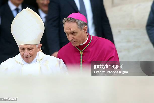 Pope Emeritus Benedict XVI, flanked by Prefect of the Pontifical House and his former personal secretary, Georg Ganswein, arrives at the Canonization...