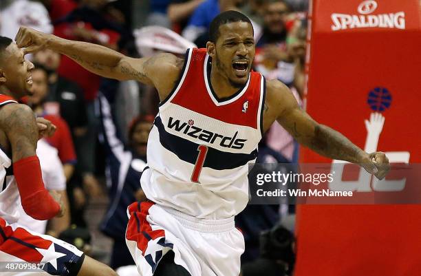 Trevor Ariza of the Washington Wizards celebrates after scoring a key basket late in the fourth quarter against the Chicago Bulls in Game Four of the...