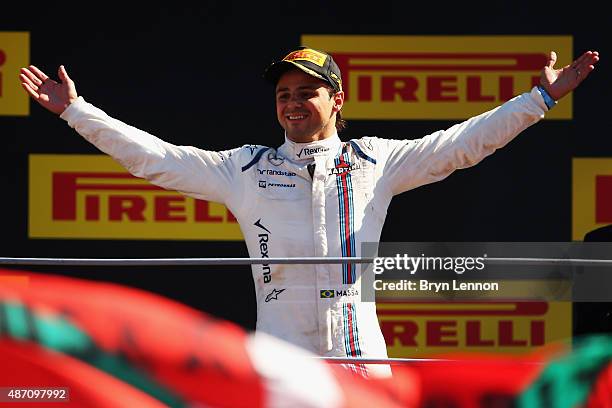 Felipe Massa of Brazil and Williams celebrates on the podium after finishing third in the Formula One Grand Prix of Italy at Autodromo di Monza on...